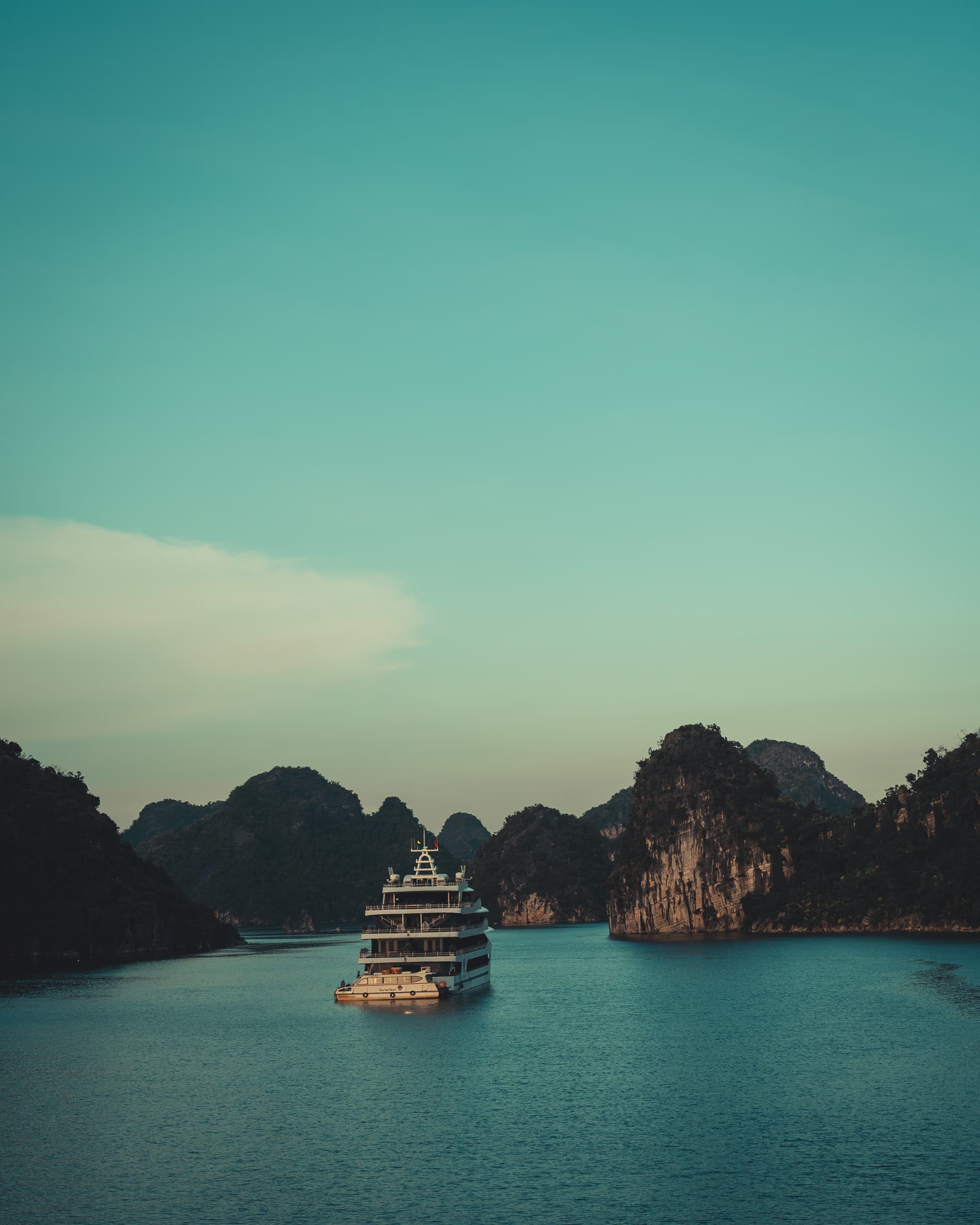 A boat among the limestone islands of Ha Long Bay, Vietnam