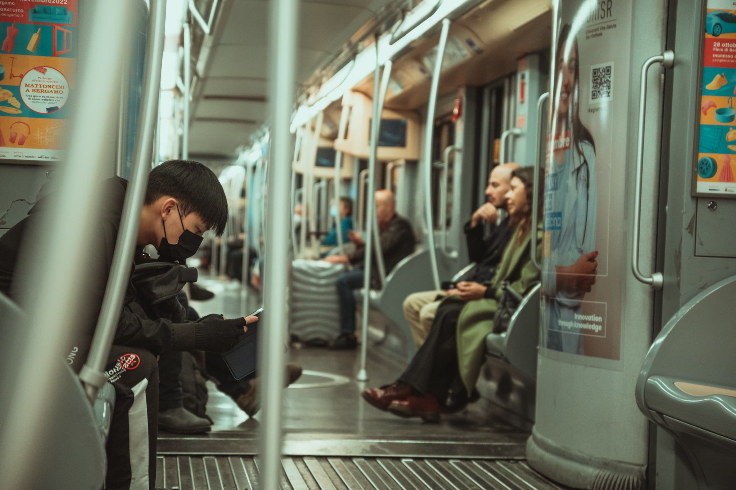 Passengers seated in a quiet metro carriage